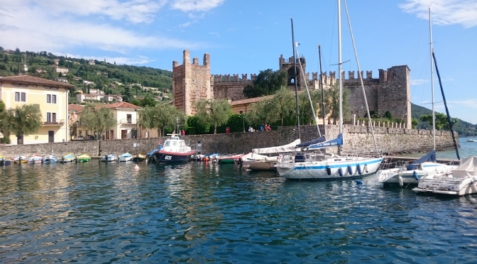 Jumping from Maderno to Torri del Benacco by boat